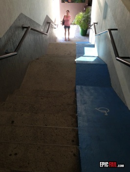 a photograph of a very steep ramp that goes alongside a flight of stairs