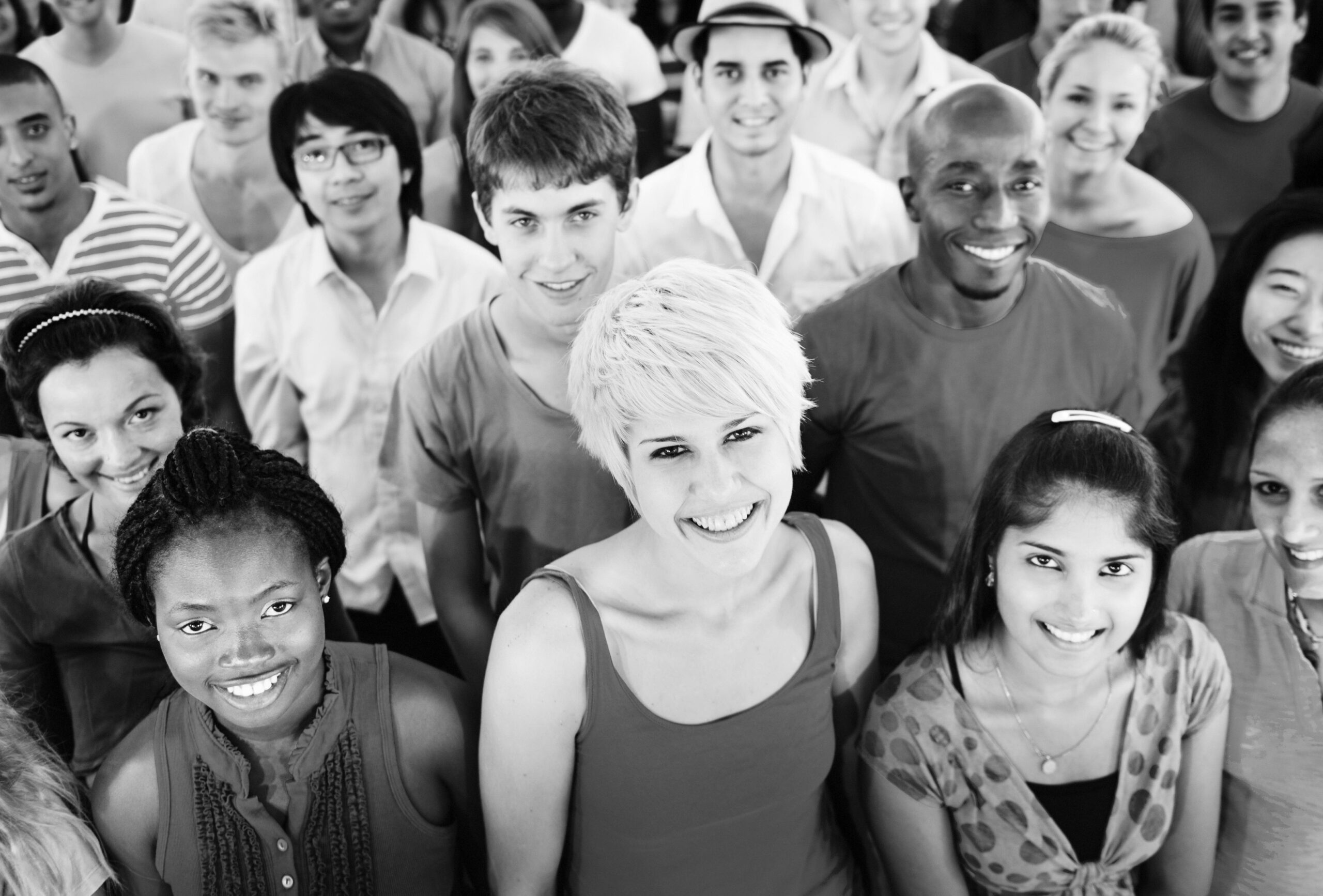 Black and white photo of a large group of diverse people.